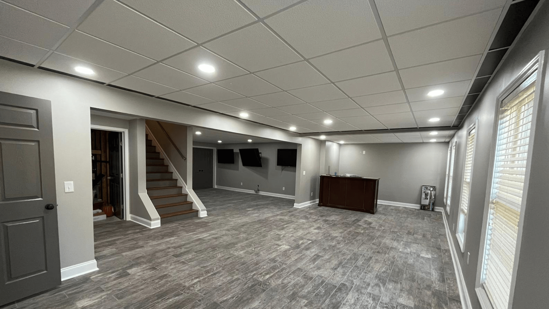 Elegant hardwood flooring in a modern living room with natural lighting.